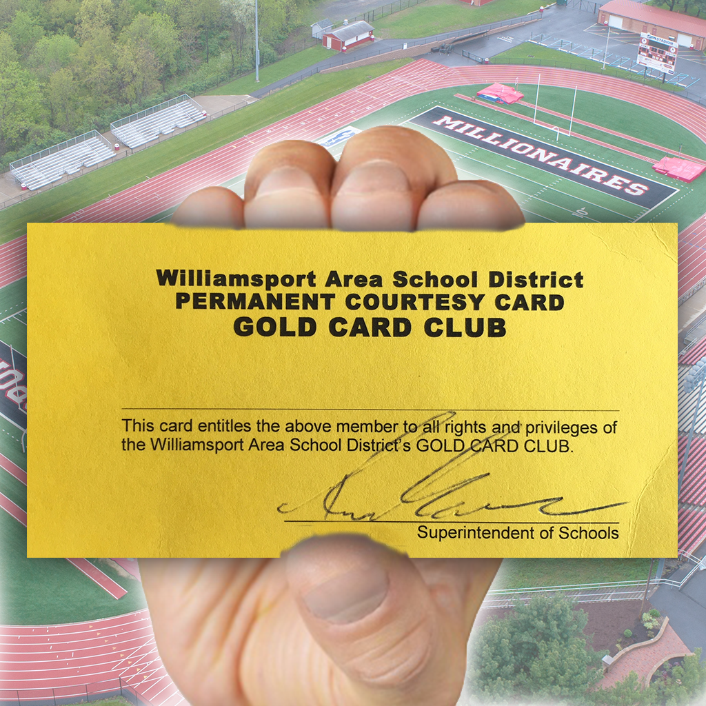 A hand grasps an example of WASD's Gold Card.